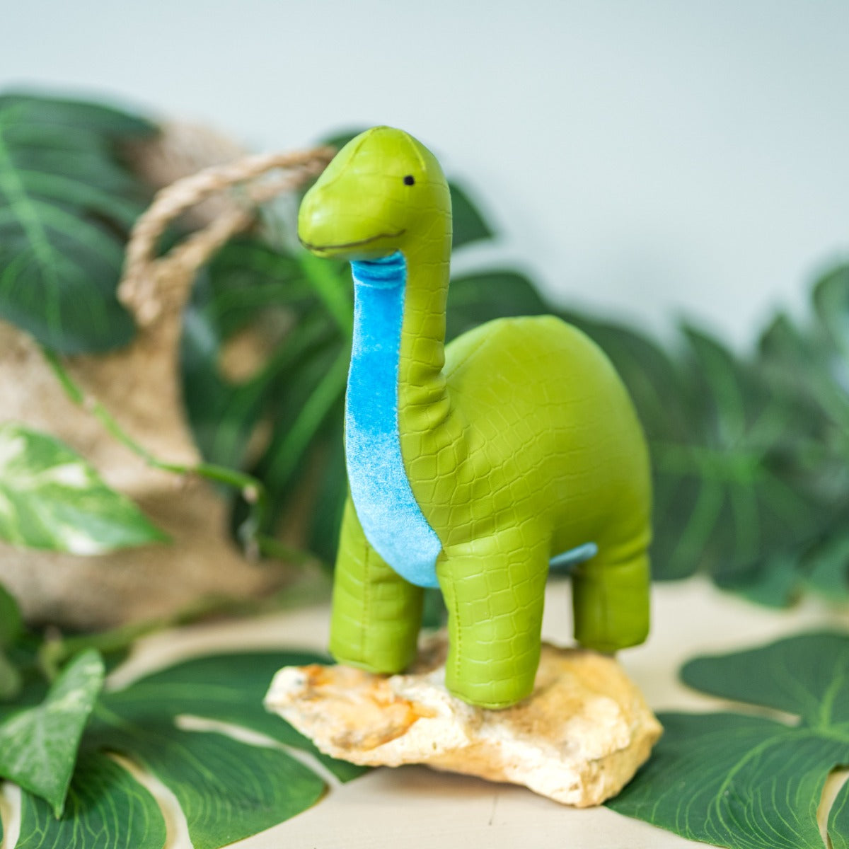 Little big friends Hector the Brachiosaurus with a jungle background
