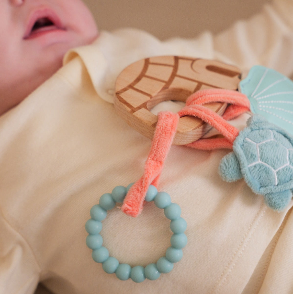 Little big friends wooden rattle with aquatic theme teething ring close up