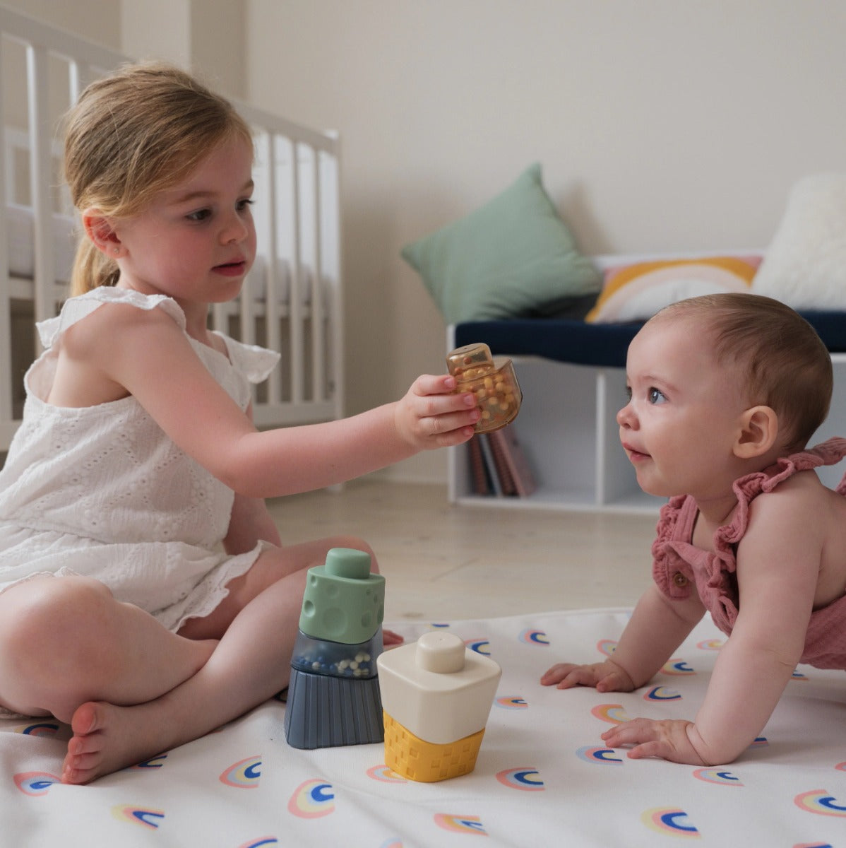 Two children playing with Sensory Stacking Tower