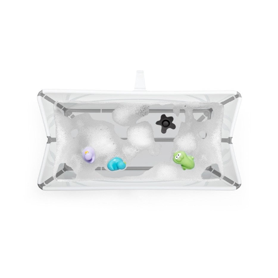 Stokke Flexi Bath in White with water and toys
