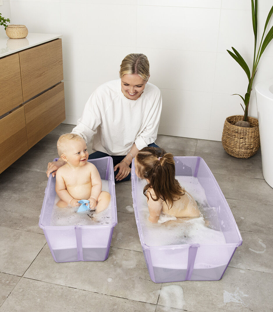 Stokke Flexi Bath in Lavender and toddler bath with happy family bathing
