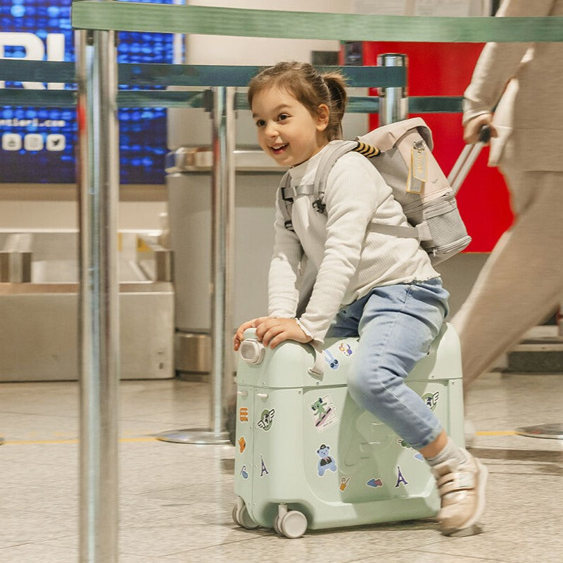 Child Sitting on Stokke Bedbox while wearing JetKids™ by Stokke® Crew Backpack in White