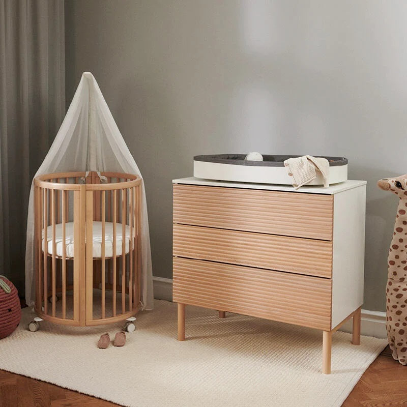 Stokke Sleepi Dresser natural next to cot