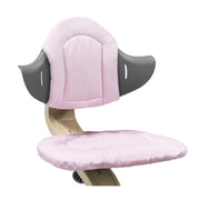 Nomi Pink cushion from Stokke attached in a chair:image,small_image,thumbnail,swatch_image