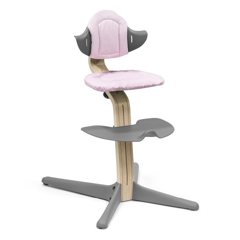 Nomi Pink cushion from Stokke attached in a chair