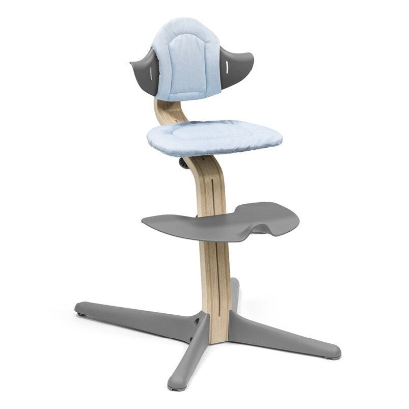 Nomi Blue cushion from Stokke attached in a chair