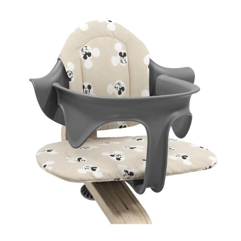 Nomi cushion with Mickey Mouse Print from Stokke with babyset