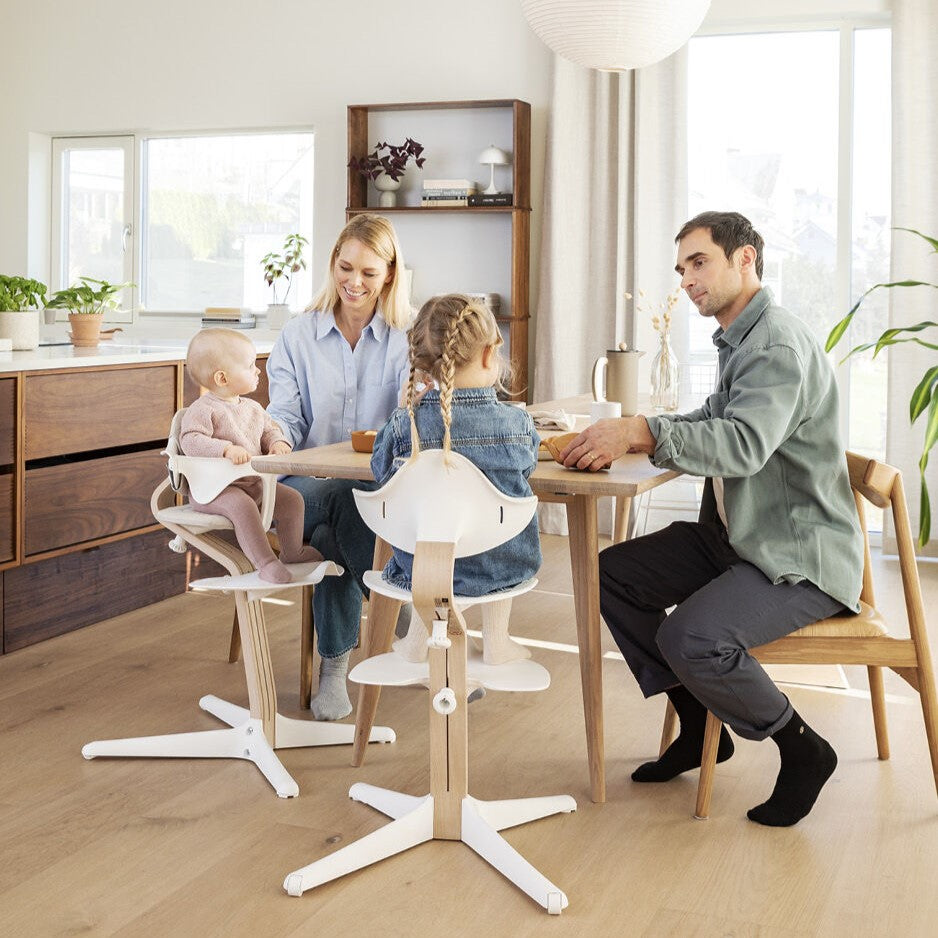 parents and baby girls in Nomi Babyset in White from Stokke
