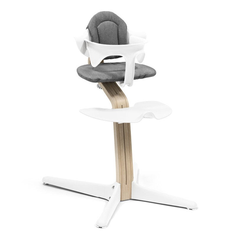 Nomi Natural white highchair from Stokke  with grey cushion