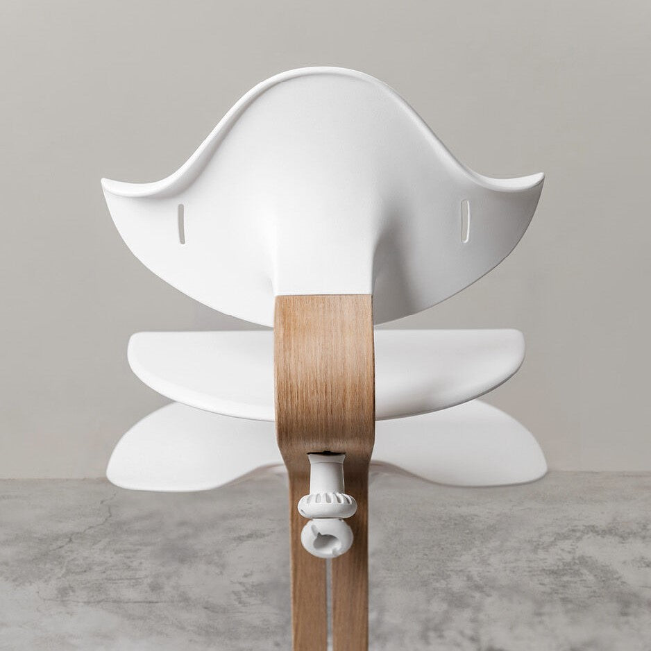 Nomi Natural white highchair from Stokke rear view
