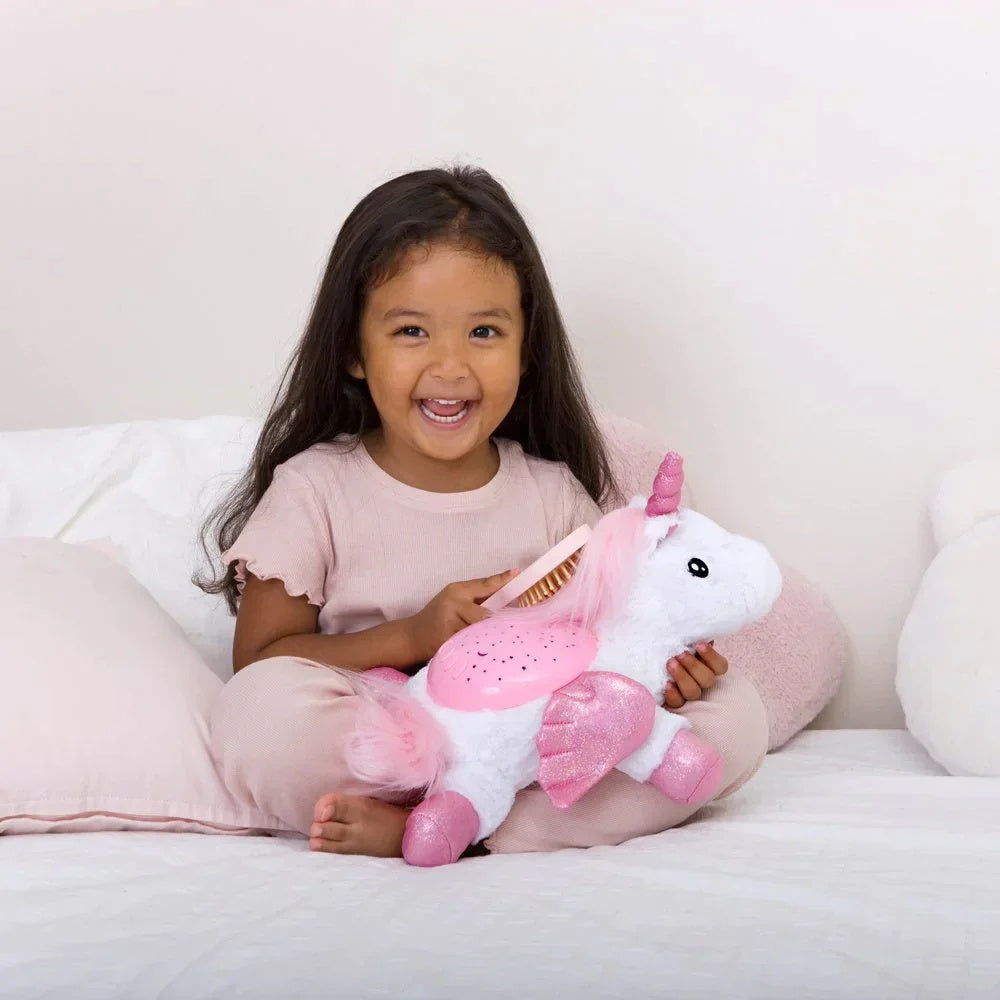 Little girl holding Cloud.b Twilight Buddies - Unicorn 