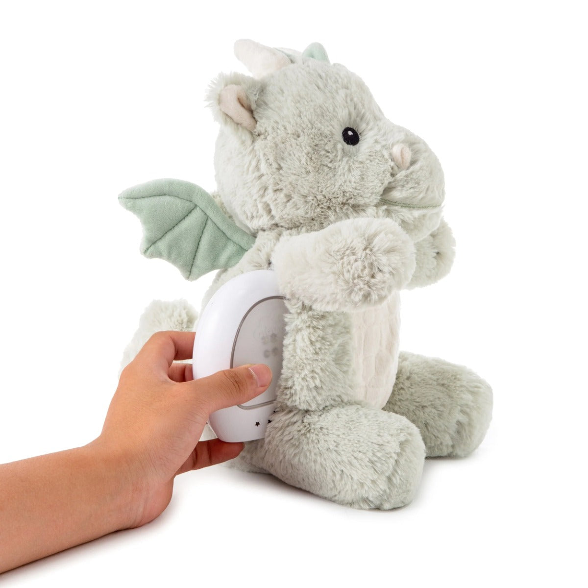 Cloud.b Lovelight Buddies - Drake the Dragon being fitted with the light/music box
