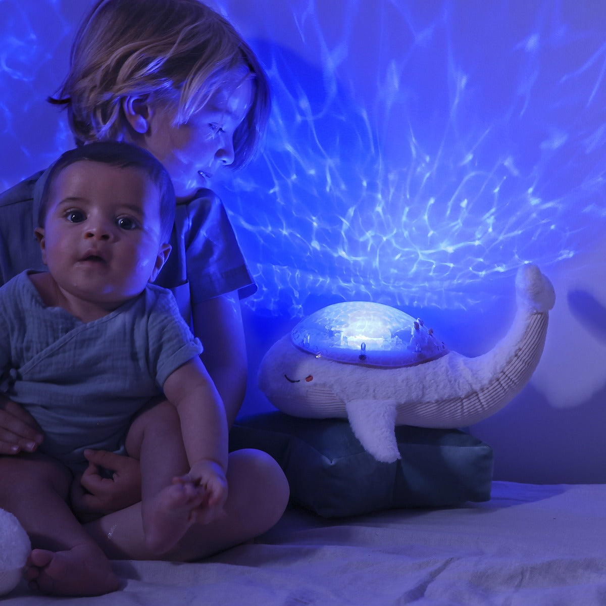 Baby with mom in a room with Tranquil nightlight