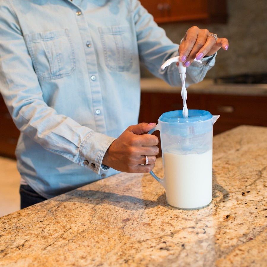 lady holding Dr Brown's Formula Mixing Jug
