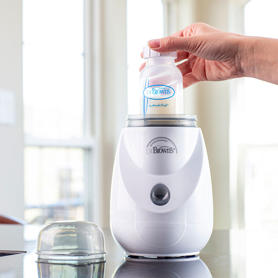 Dr Browns Insta-Feed Bottle Warmer and Steriliser With milk bottle getting warm