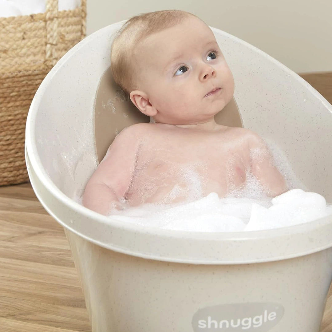 Baby sitting in Eco Shnuggle Bath