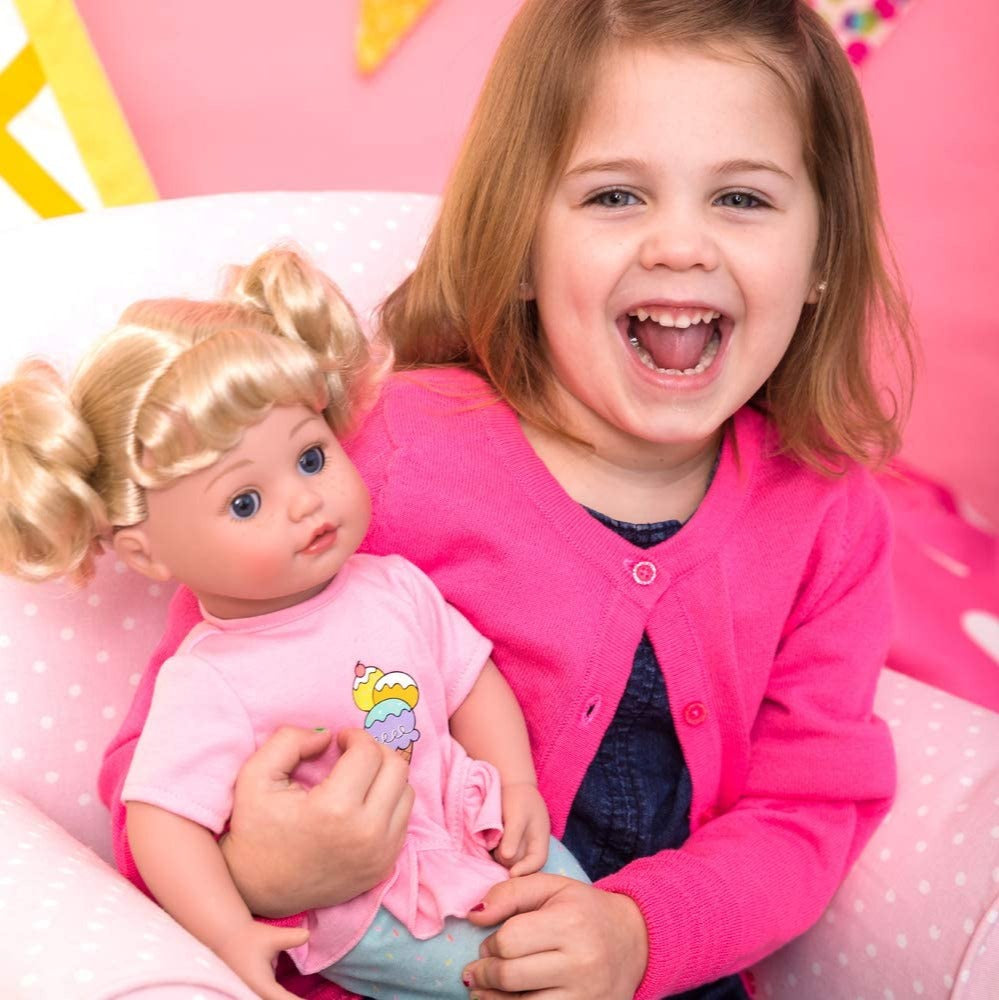 Girl holding Adora Touch Activated Cuddle Doll