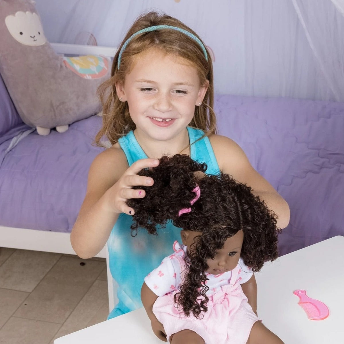 Little girl styling Doll's hair