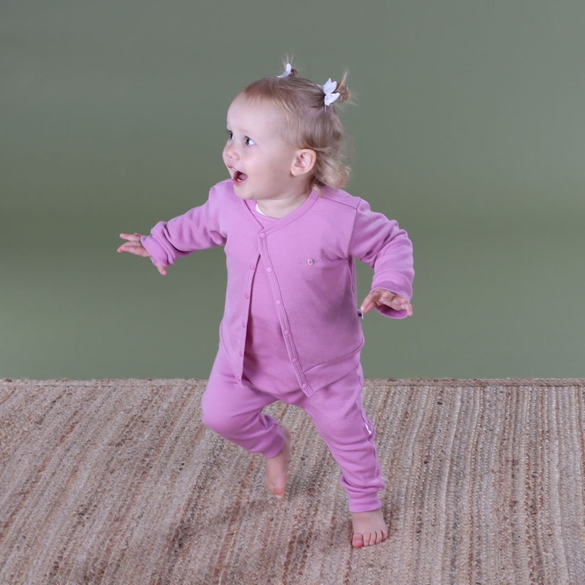 baby girl wearing orchid cardigan from dimples arctic adventures collection