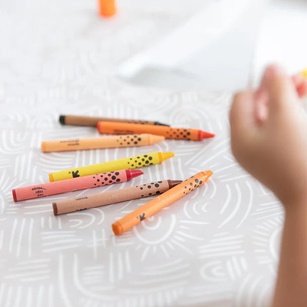 Crayon colors on Wander waterproof splat mat by bumkins.
