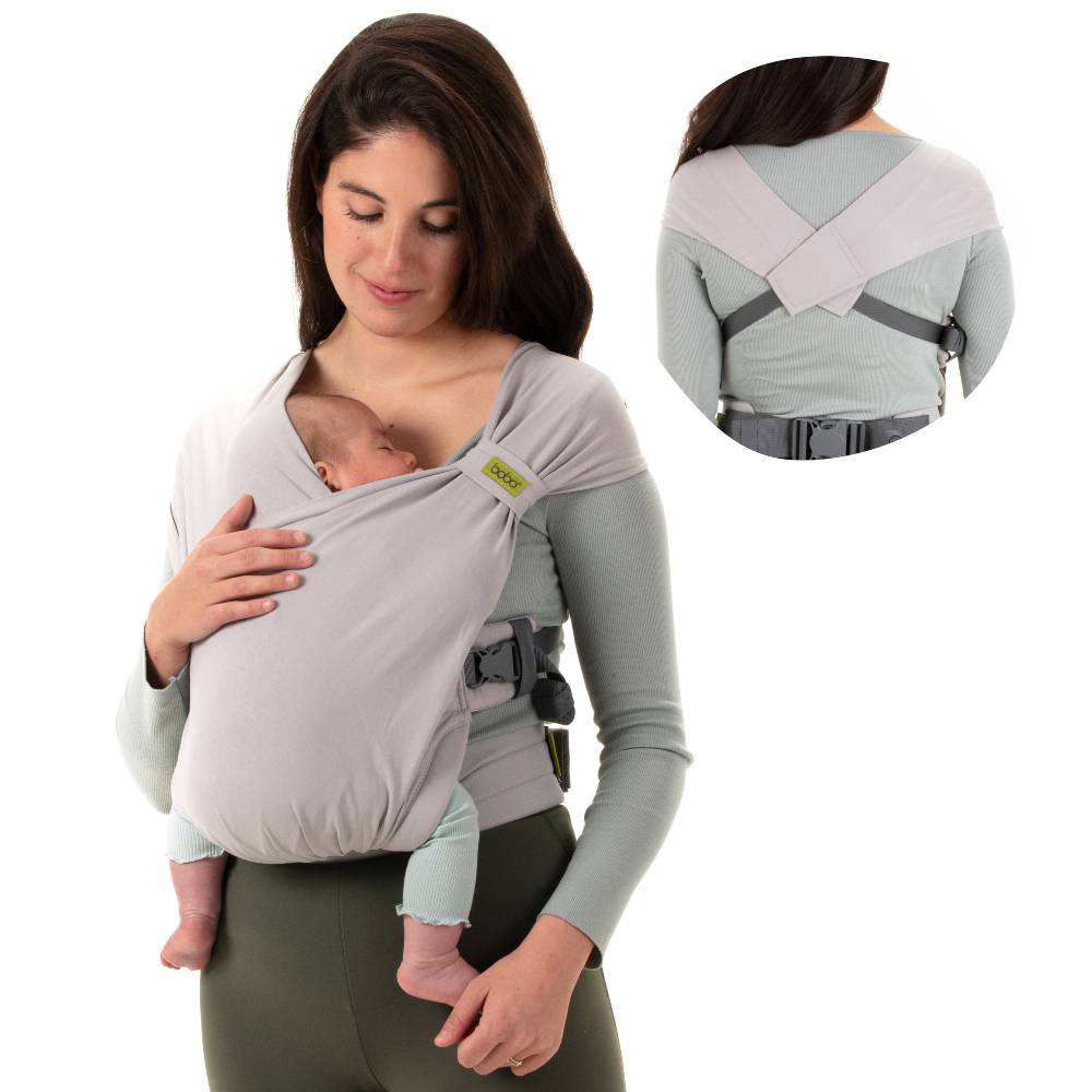 Lady holding baby cradled in Boba Bliss baby carrier in grey with back view