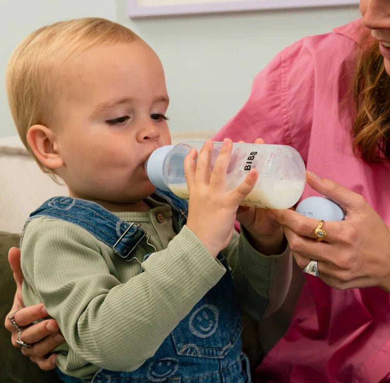 Toddler drinking from Bibs Latex bottle 150ml