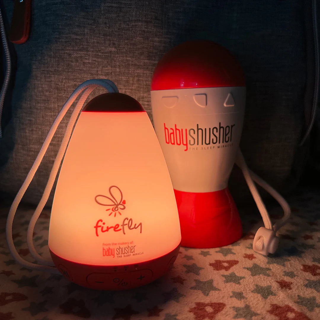 Firefly baby soother and night light from Baby Shusher on couch