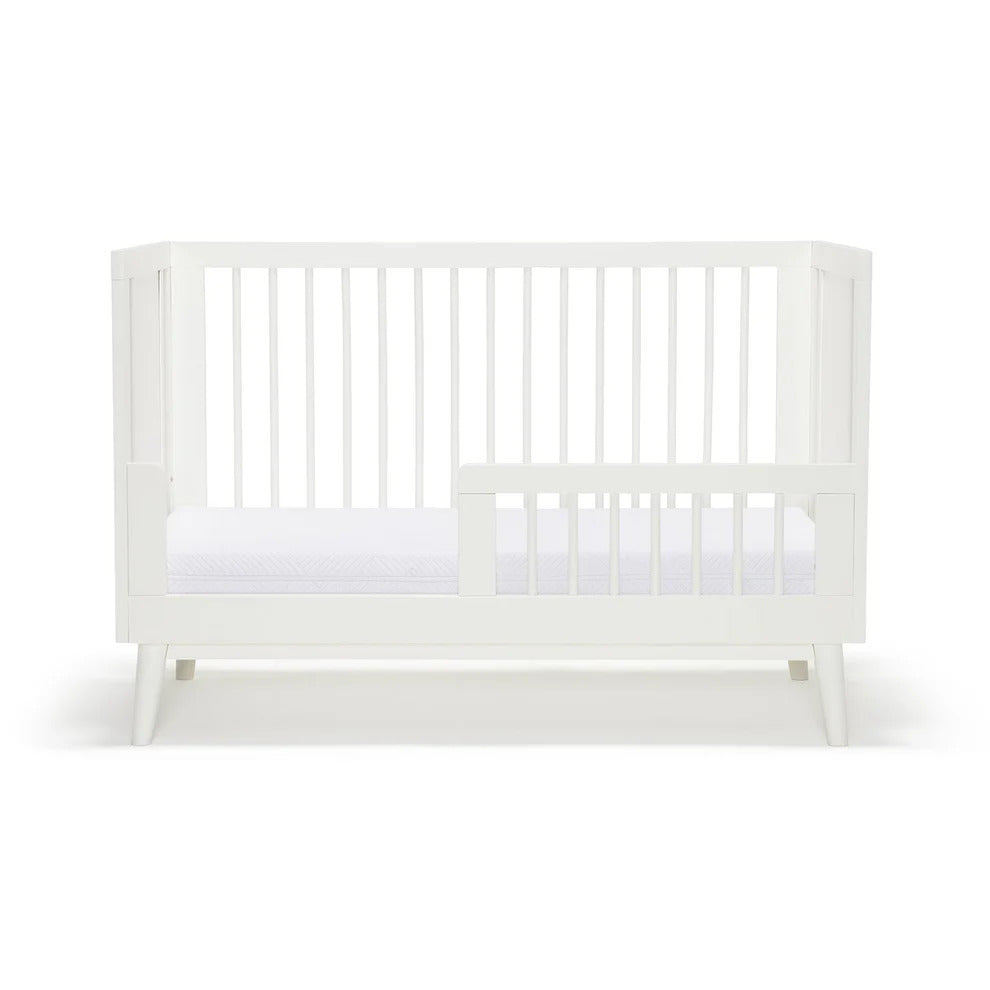 Kaya Cot Bed rail in white on kaya cot front view