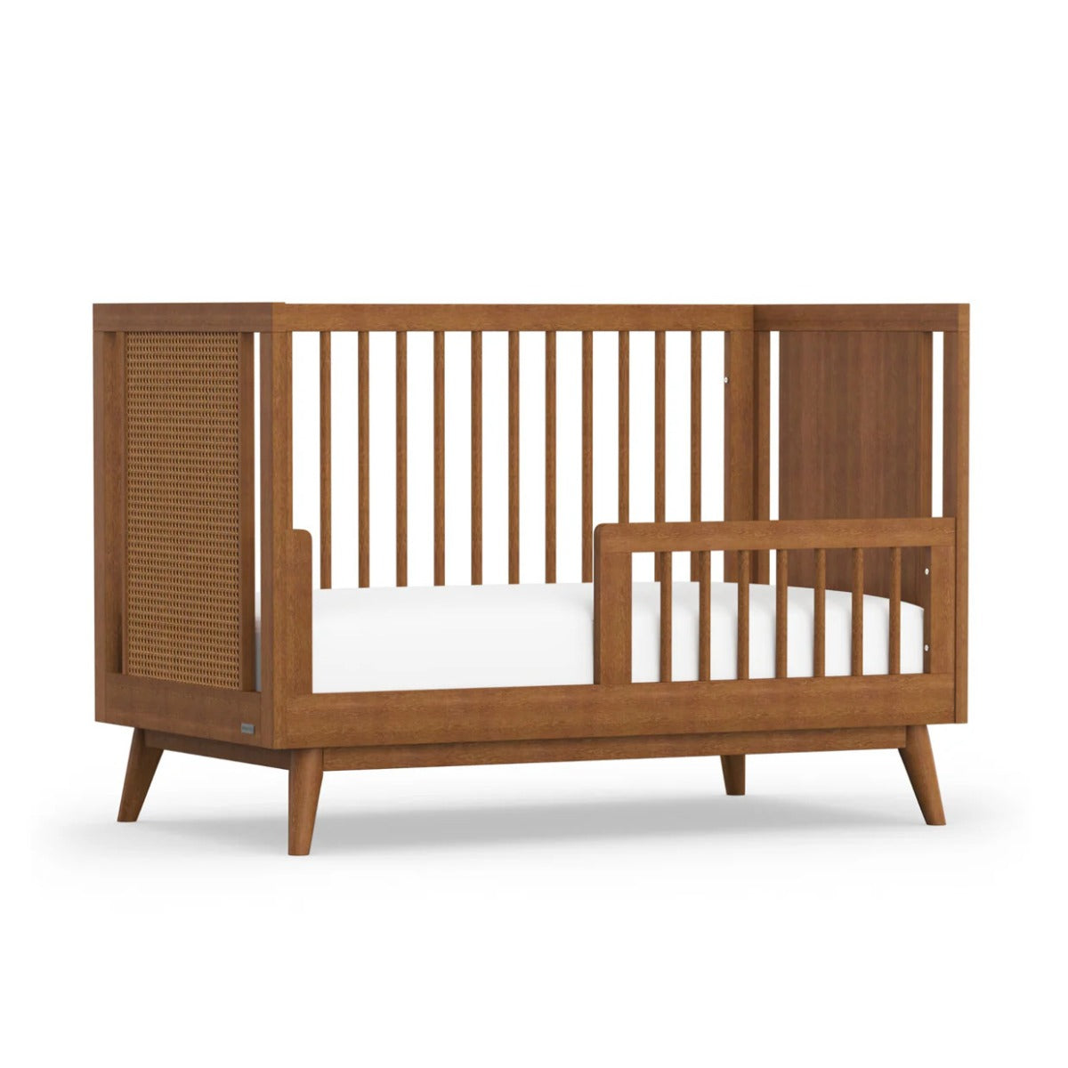 Kaya Cot Bed rail in teak on kaya cot angled view
