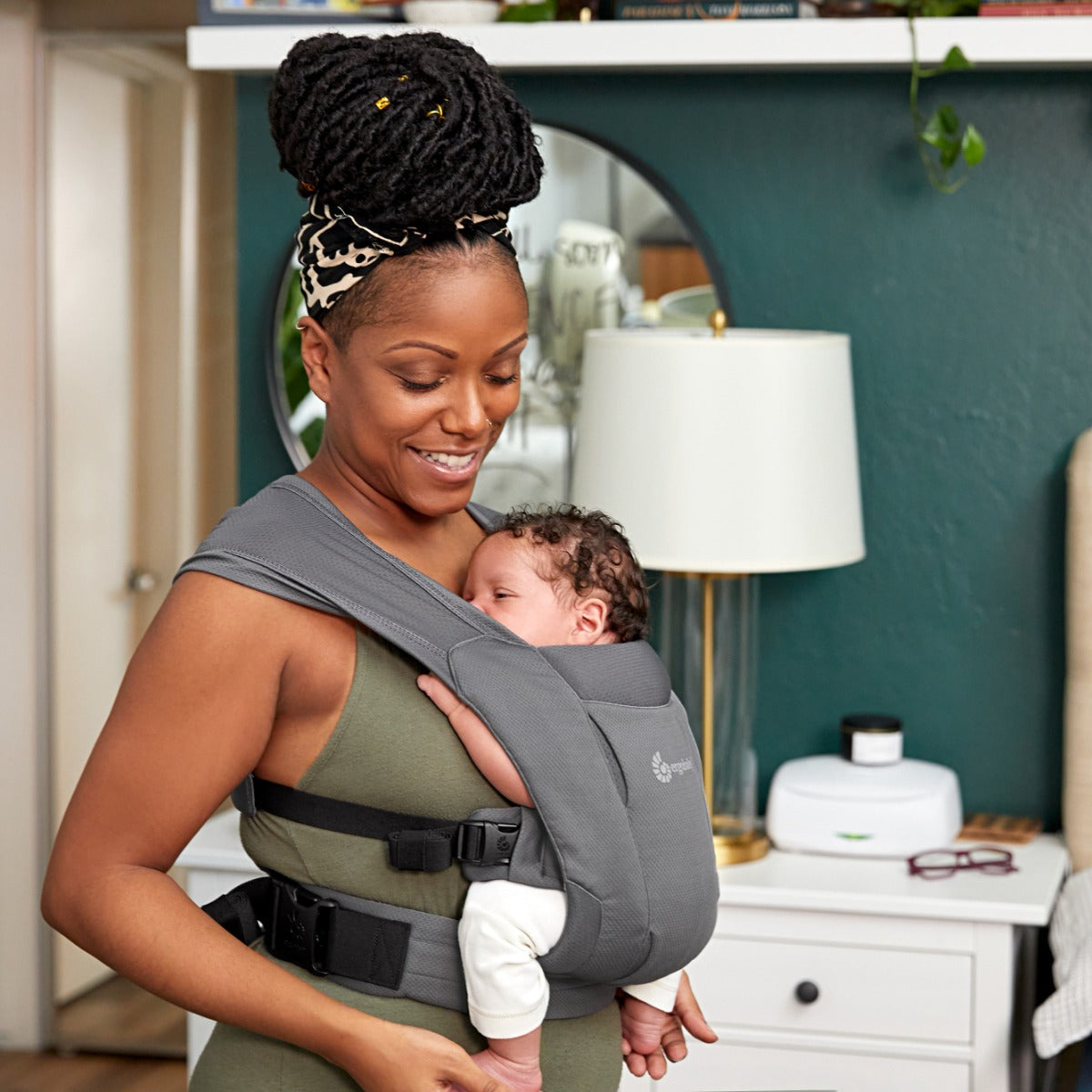Mother with a baby in Black Embrace Soft Air Mesh Carrier from Ergobaby
