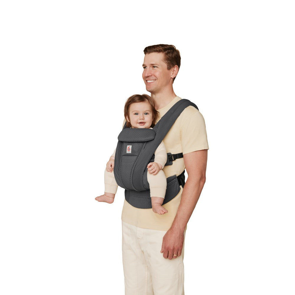 Side view father carrying baby in mesh breathable baby carrier