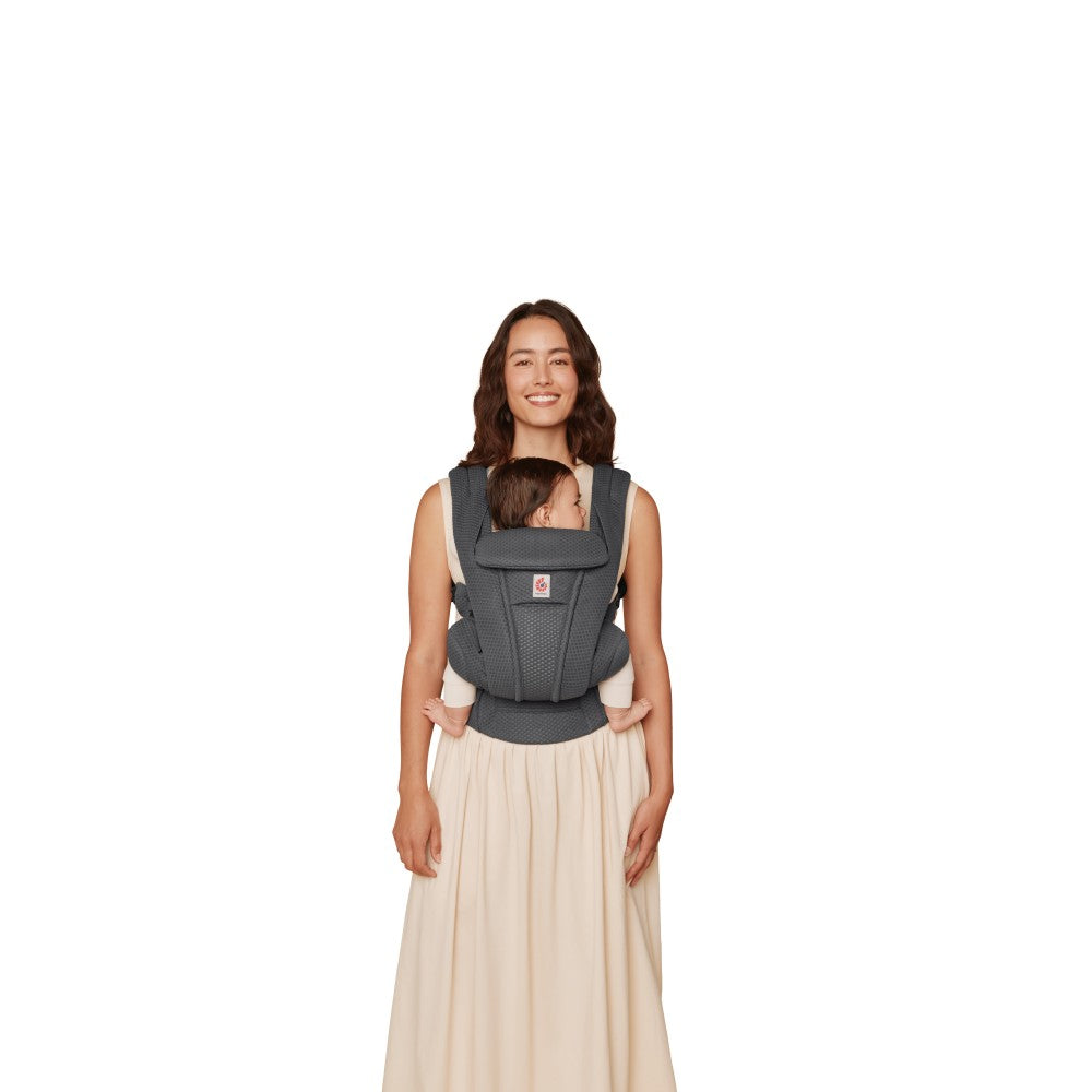 Front view Mother carrying baby in mesh breathable baby carrier