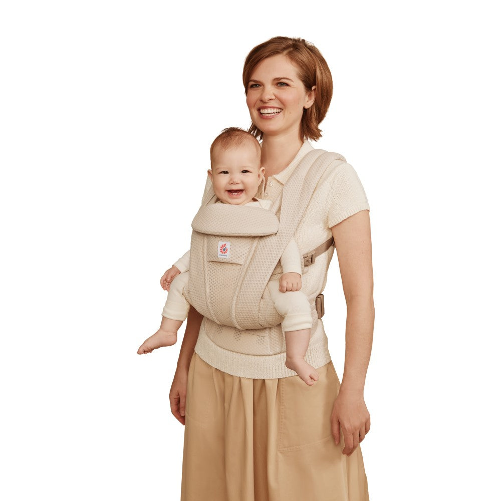 Front view Mother carrying baby in mesh breathable baby carrier