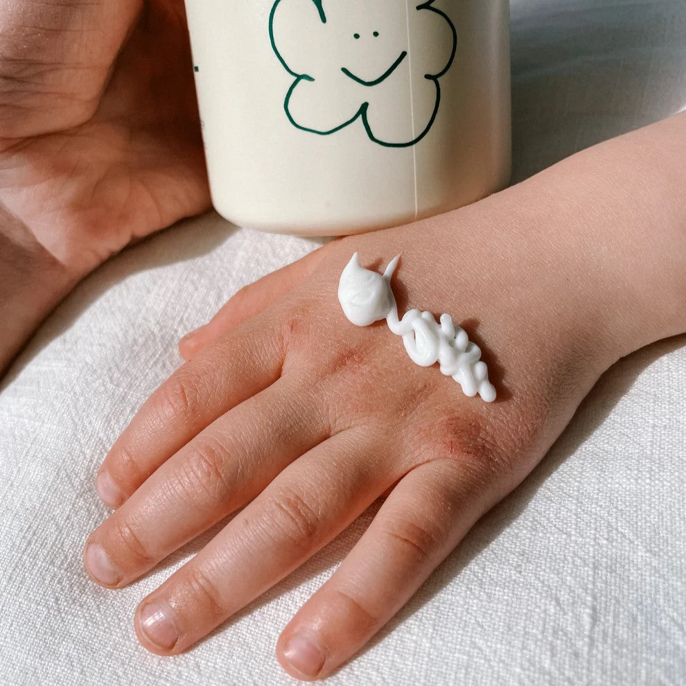 Beetl baby cream on baby hand