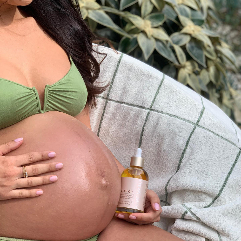 pure mama belly oil being prepared for usage