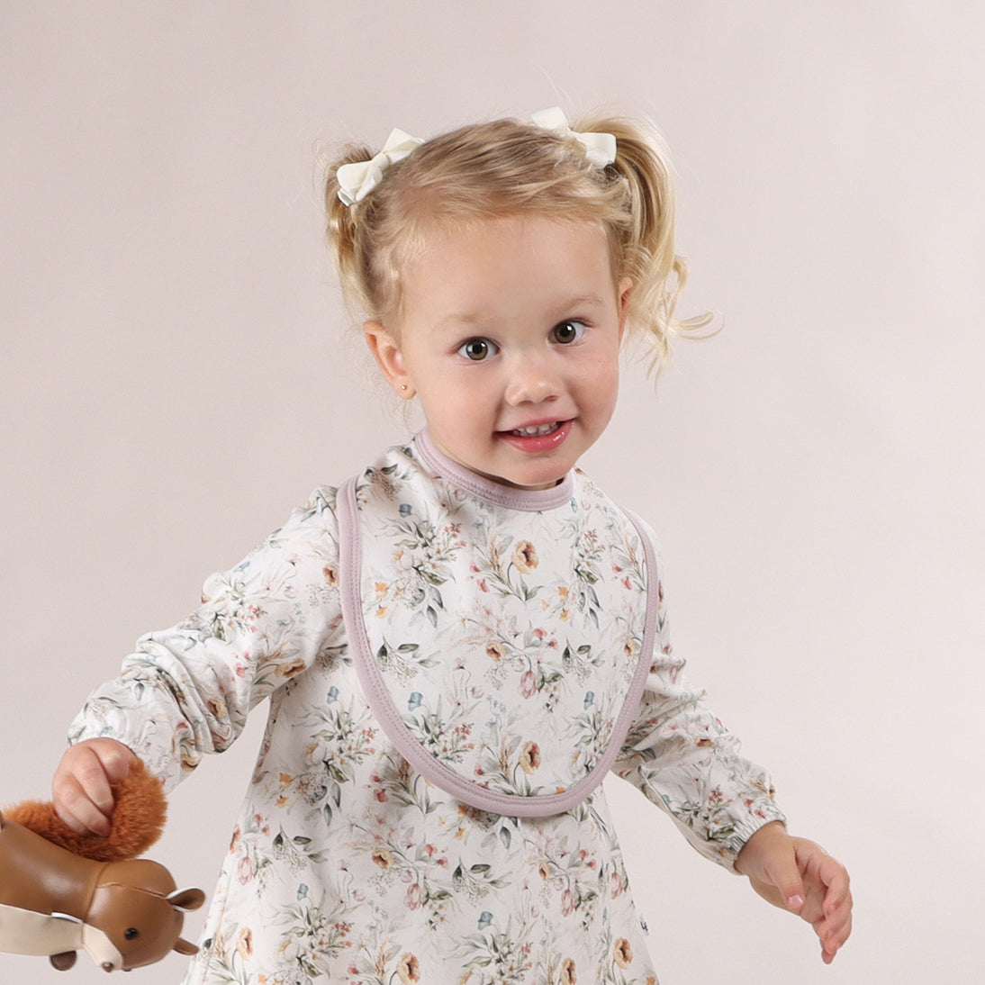 Girl wearing Cotton floral bib