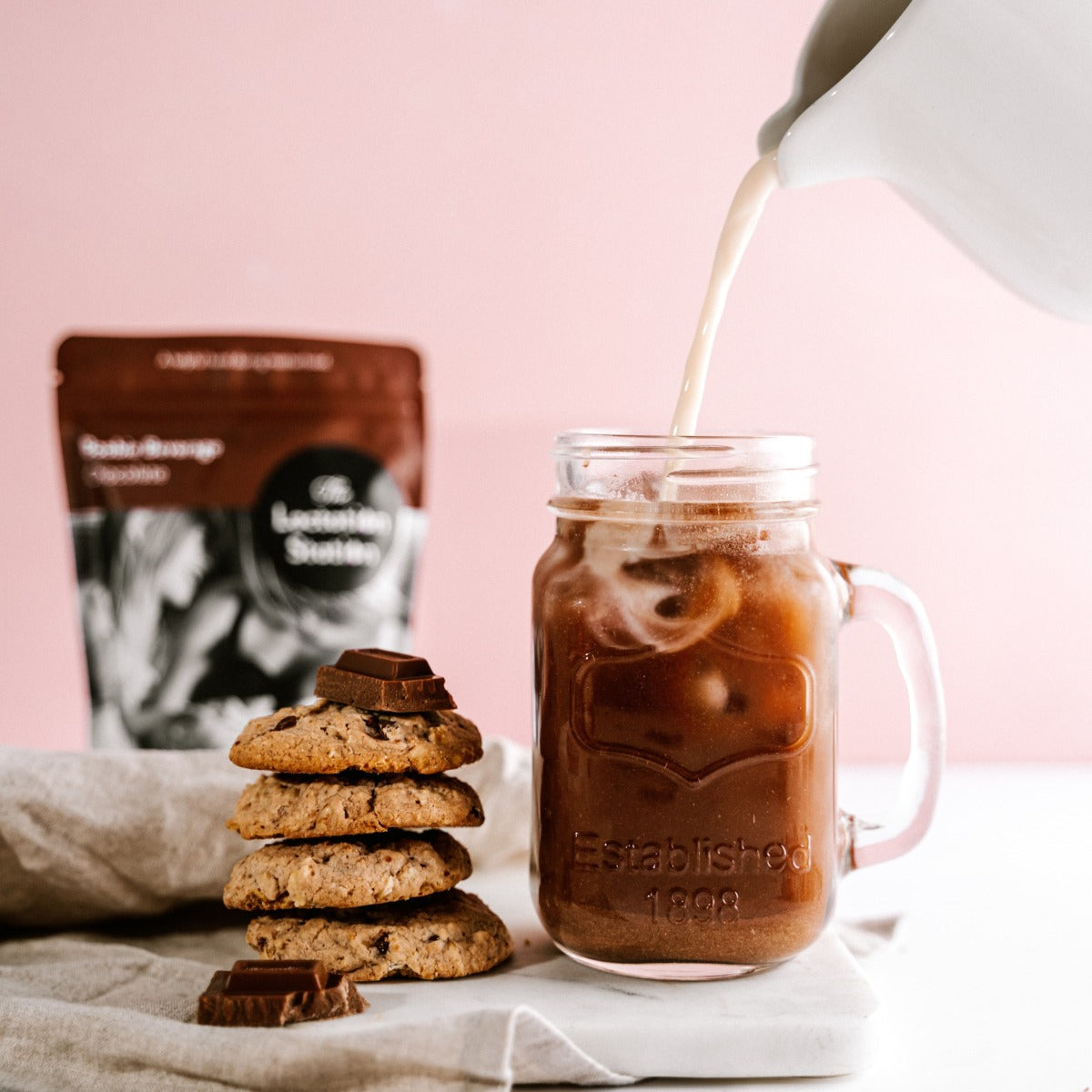 Pack of chocolate Boobie Beverage from Lactation Station with cookies and ice chocolate