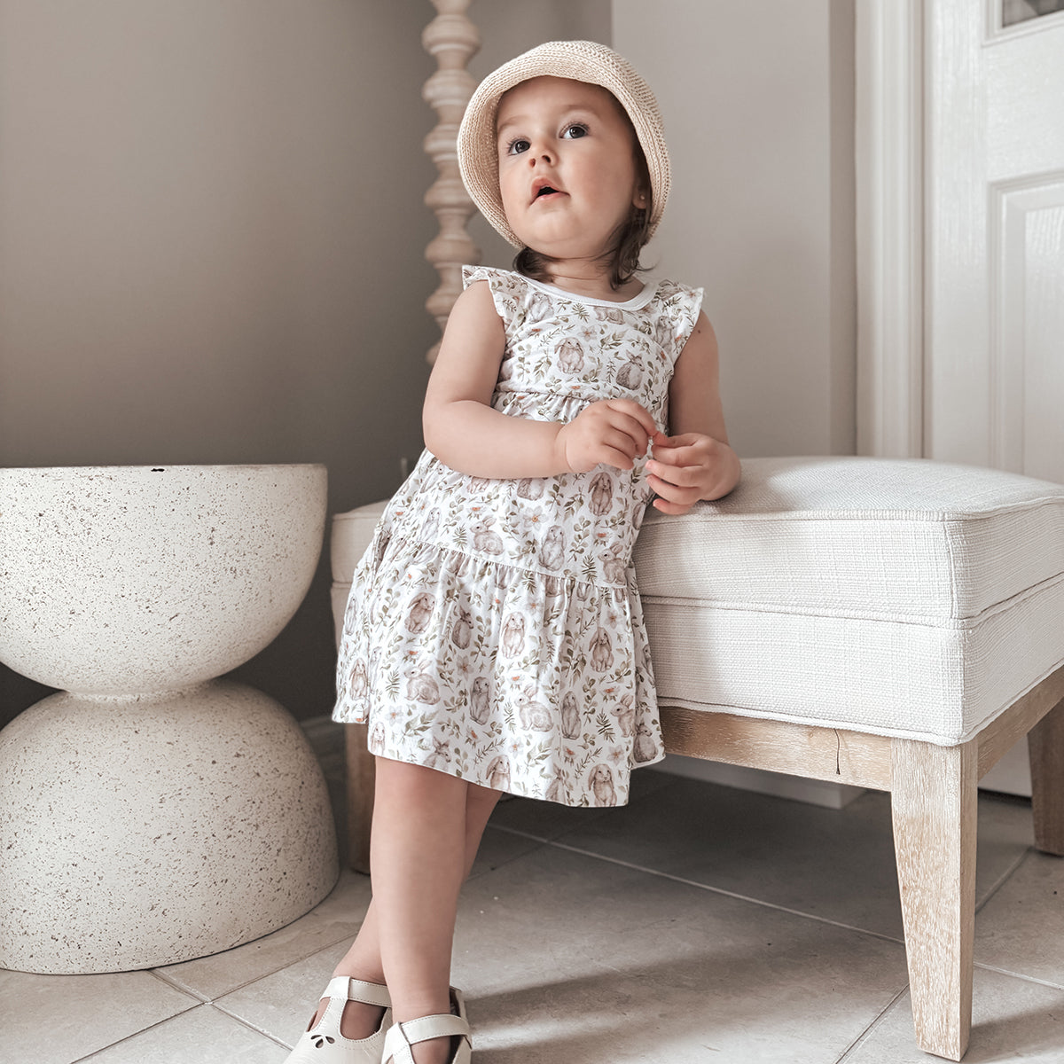 Little bee cotton tiered dress in white with bunny print lifestyle shot