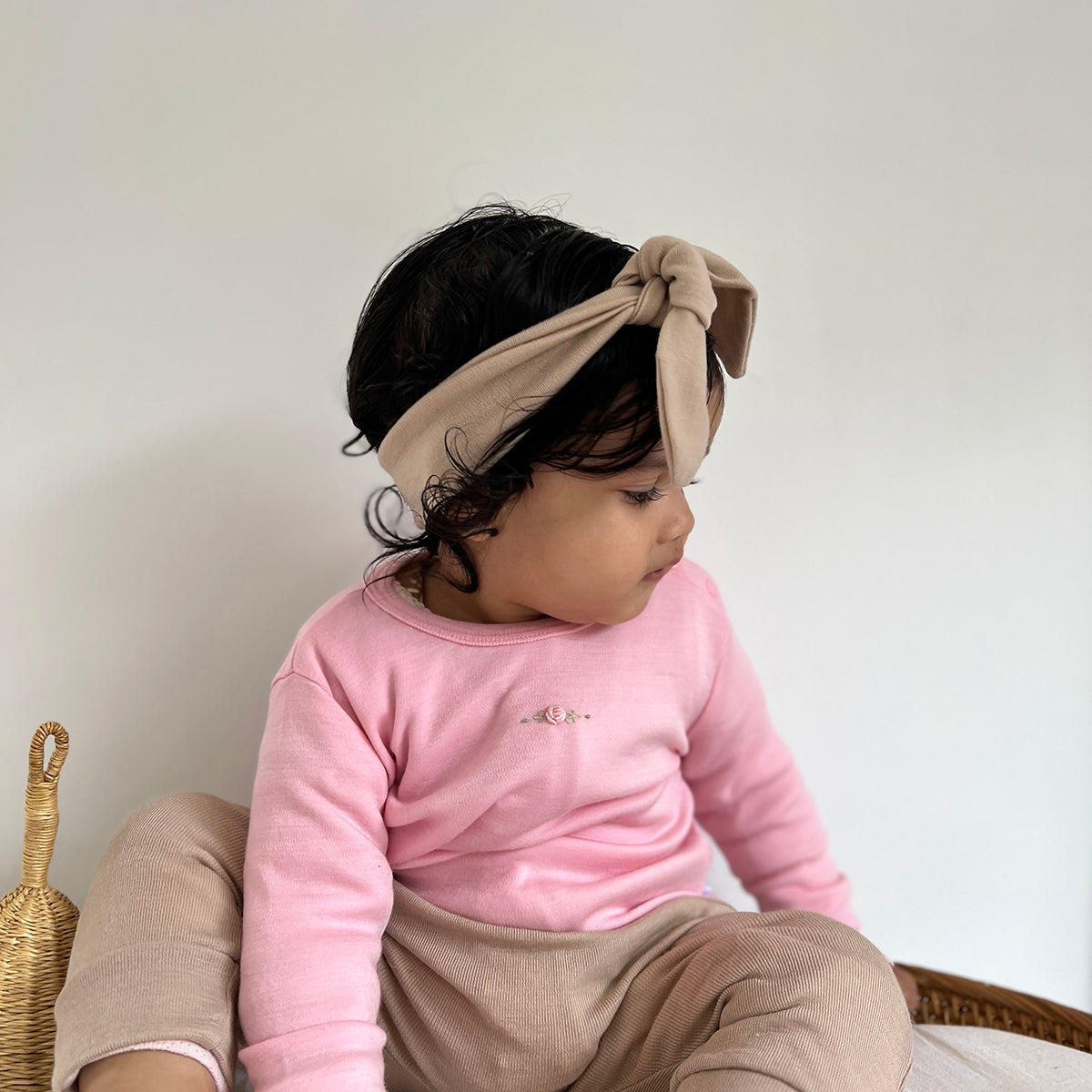 Dimples Winter Soft Snuggles Merino Tie headband In Camel Lifestyle shot
