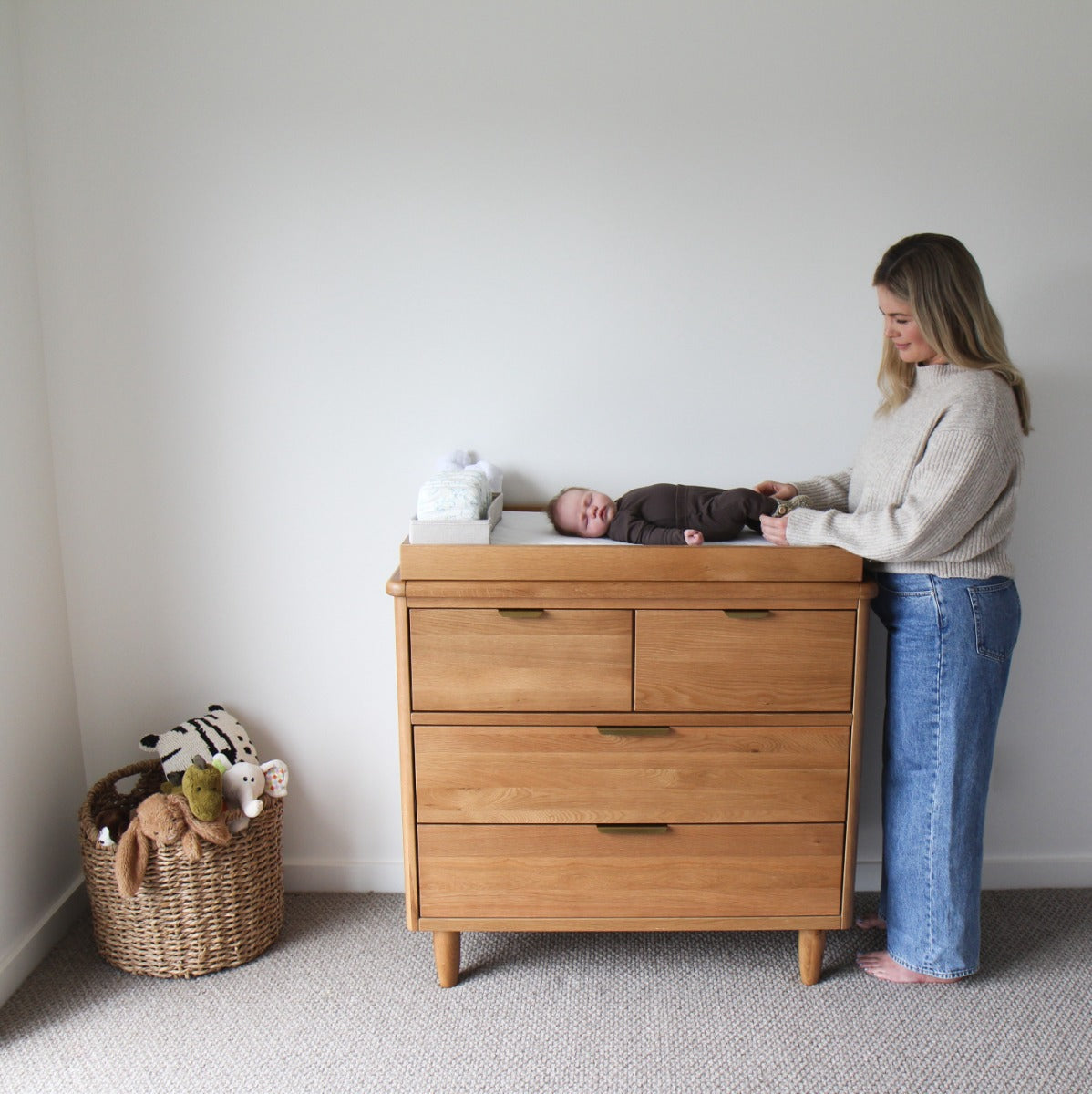 Mother changing nappy on change tray on George range Cariboo kids Room Drawers