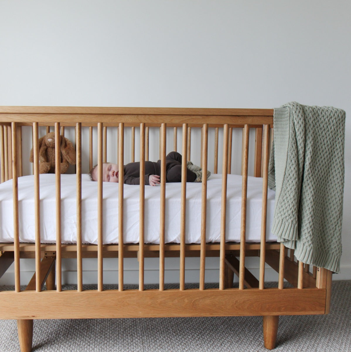 Baby sleeping in George range Cariboo furniture kids cot