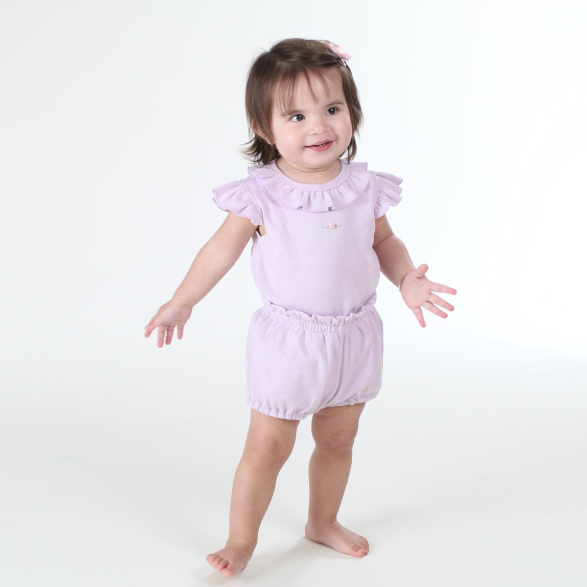 Baby wearing Cotton lilac frill top with rose embroidery and lilac cotton bloomer