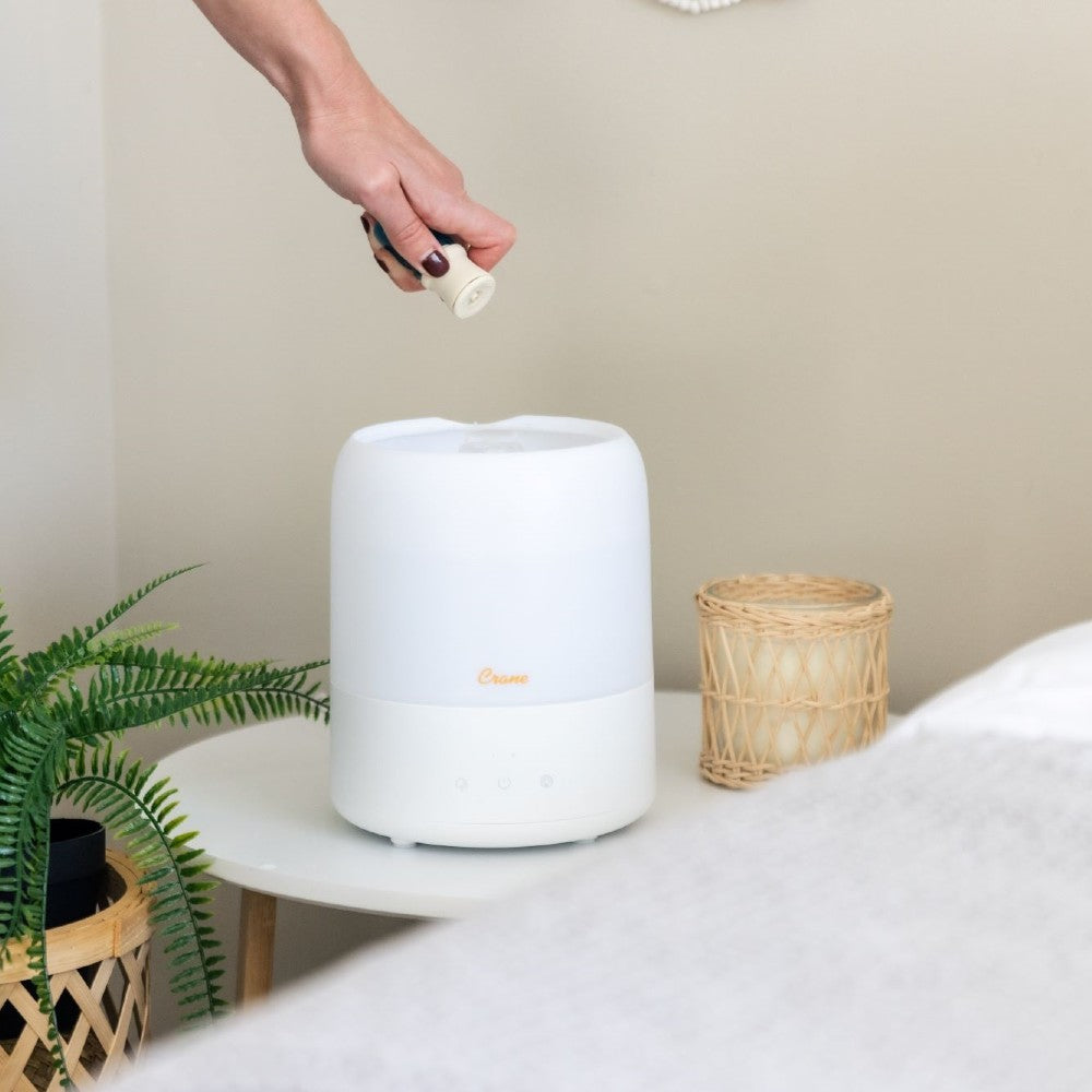 Refilling the essential oil with top fill Aroma diffuser