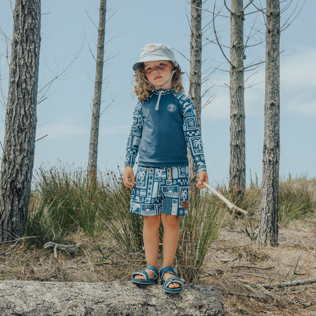 Little girl wearing Crywolf beach sandals in Seaside Blue