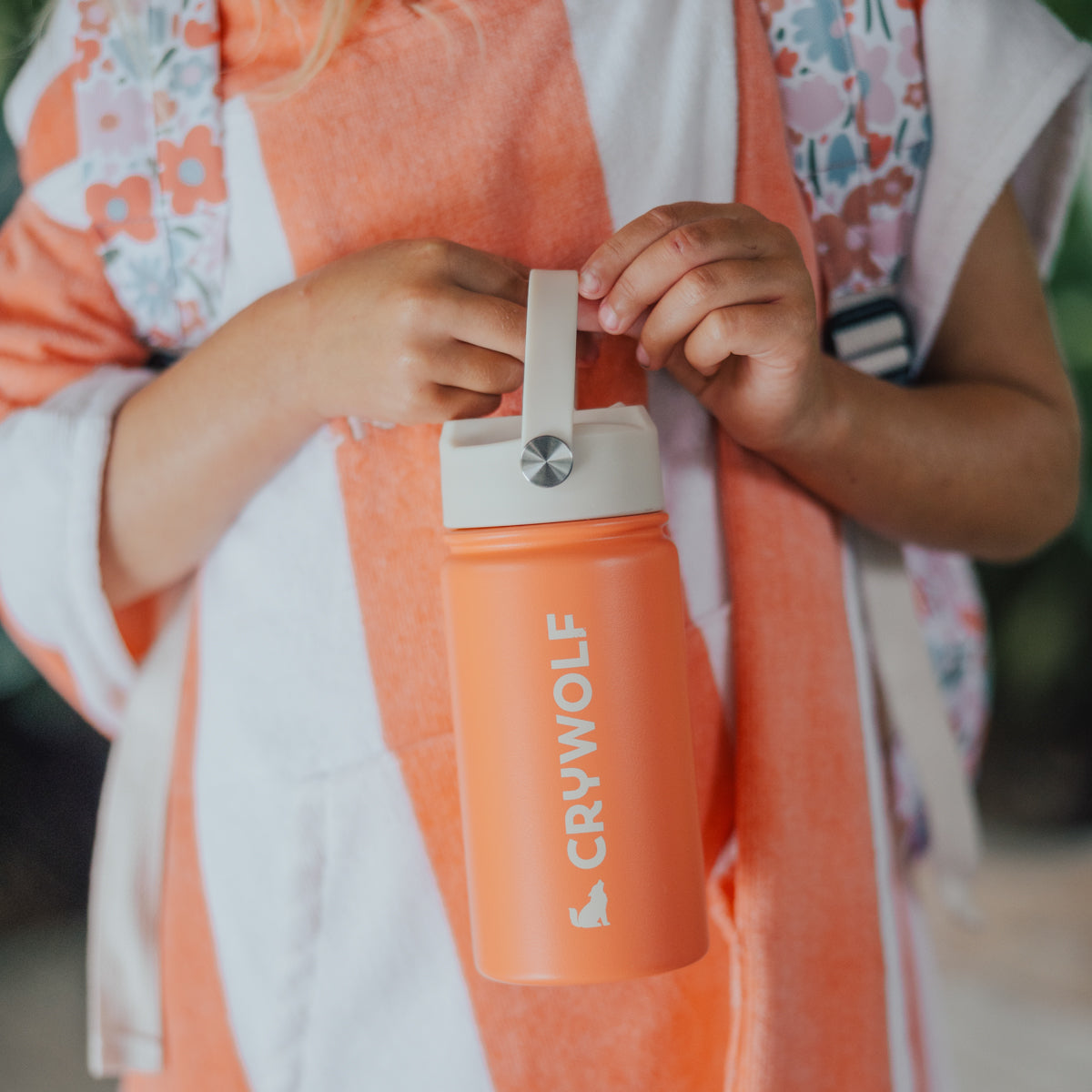 Little girl holding Crywolf Coral Drink Bottle 400ml handle
