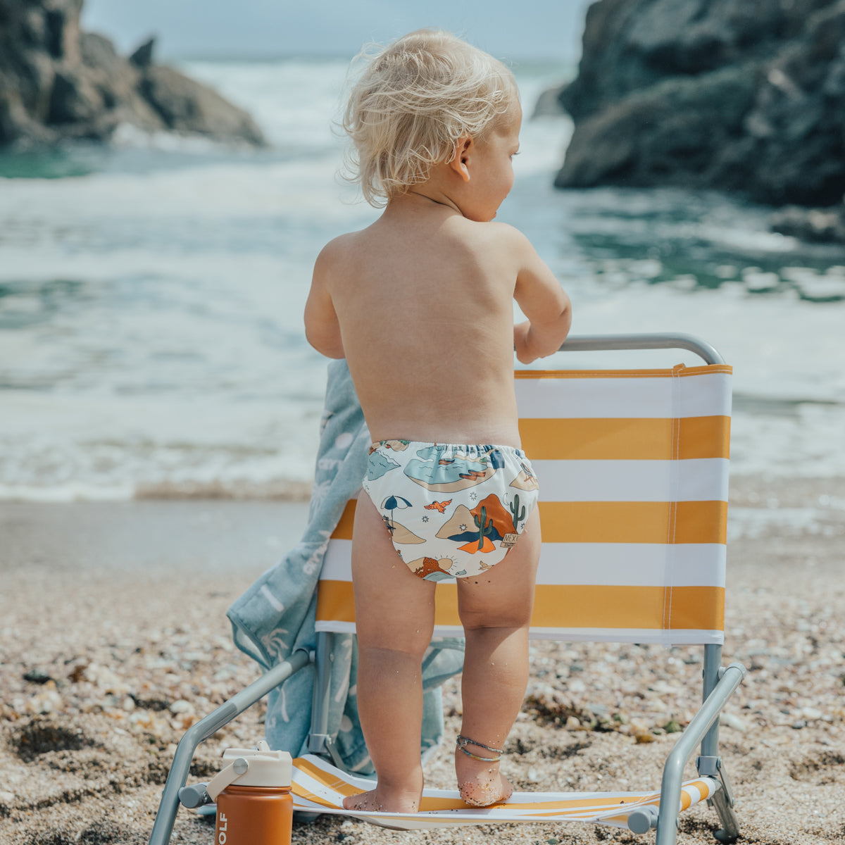 Baby wearing Cry Wolf Reusable Swim Nappy paradise