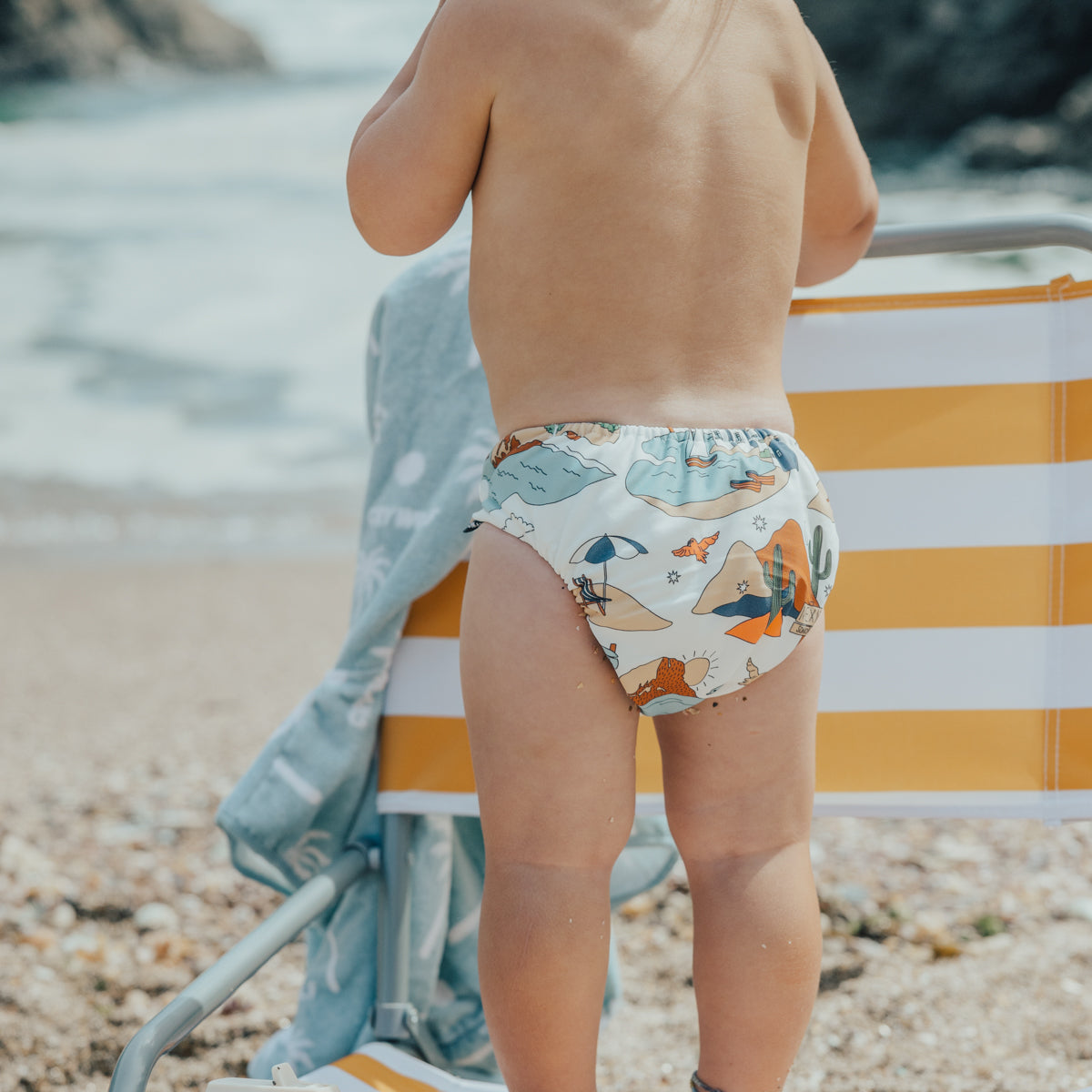 Baby wearing Cry Wolf Reusable Swim Nappy paradise