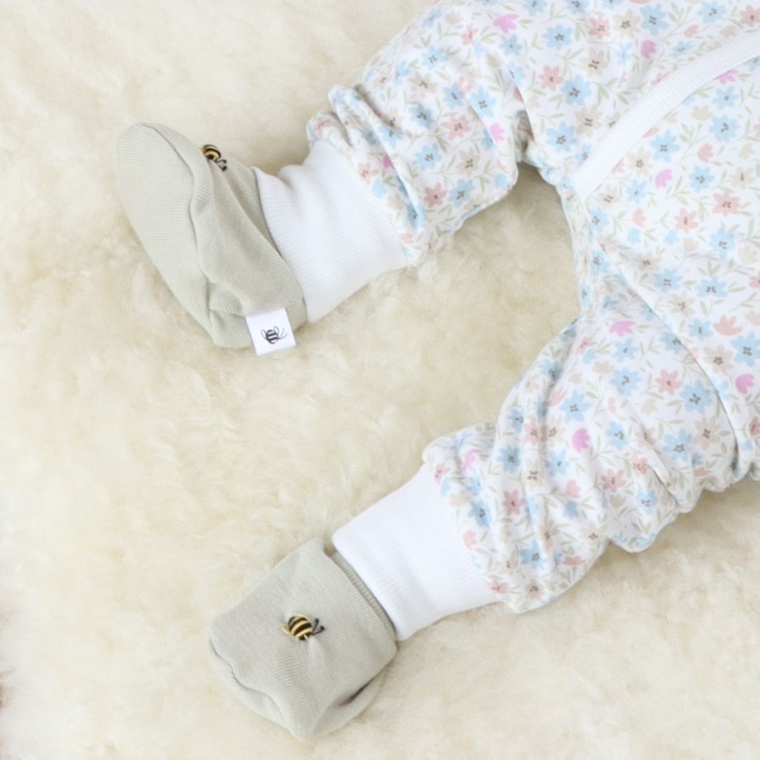 Baby wearing Merino Tea Green bootie from cosy dreams collection of Dimples New Zealand
