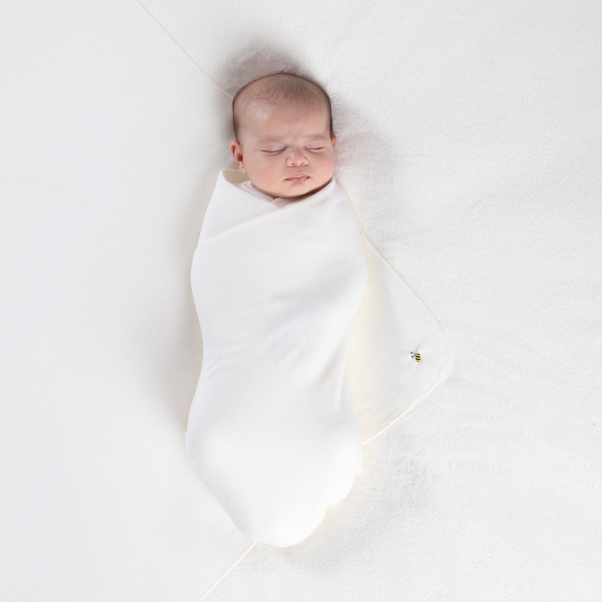 Dimples Classic Merino Extra Large Wrap in Cream Bee used as swaddle