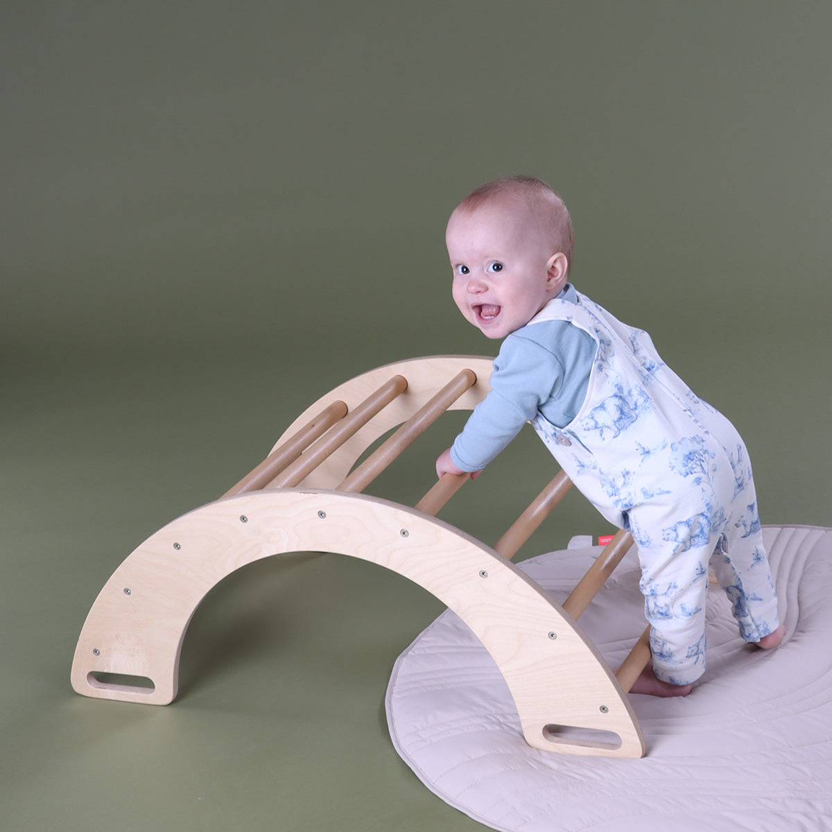 Baby climbing the kinderfeet arch